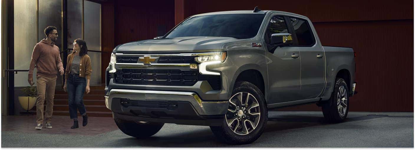 Gray 2026 Chevrolet Silverado 1500 parked outside a modern building.