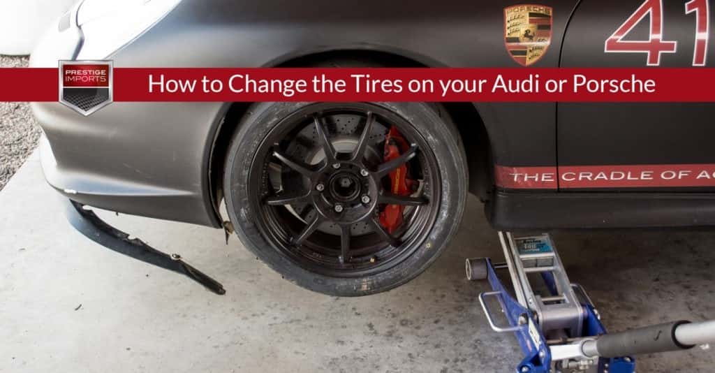 Prestige Imports Race Car with a damaged front air dam, bumper, and tire from an off-track adventure. Used to illustrate the article, "How to Change the Tires on your Audi or Porsche".