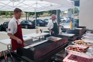 Prestige Imports GM Justin Adis mans the grill during Prestige Imports 2012 Mountain Tour barbecue