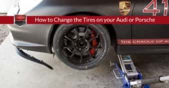 Prestige Imports Race Car with a damaged front air dam, bumper, and tire from an off-track adventure. Used to illustrate the article, "How to Change the Tires on your Audi or Porsche".