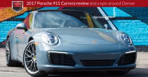 A new 2017 Porsche 911 Carrera parked in front of a colorful mural in Denver, CO.