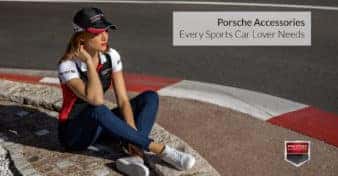 Photo of a woman wearing Porsche Driver's Selection gear at a racetrack. Used to illustrate the article, "Porsche Accessories Every Sports Car Lover Needs".