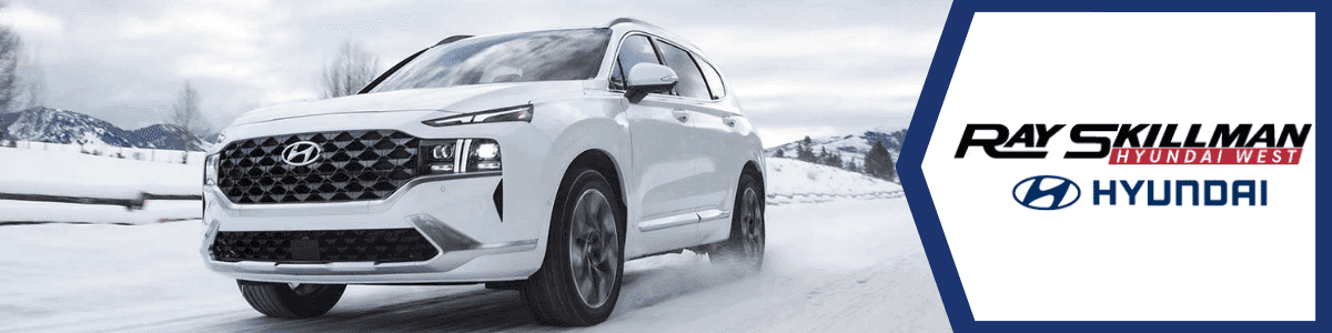 Prepping Your Hyundai Hybrid Cars for Indianapolis Winters - banner image showing a white Tucson on a snowy road