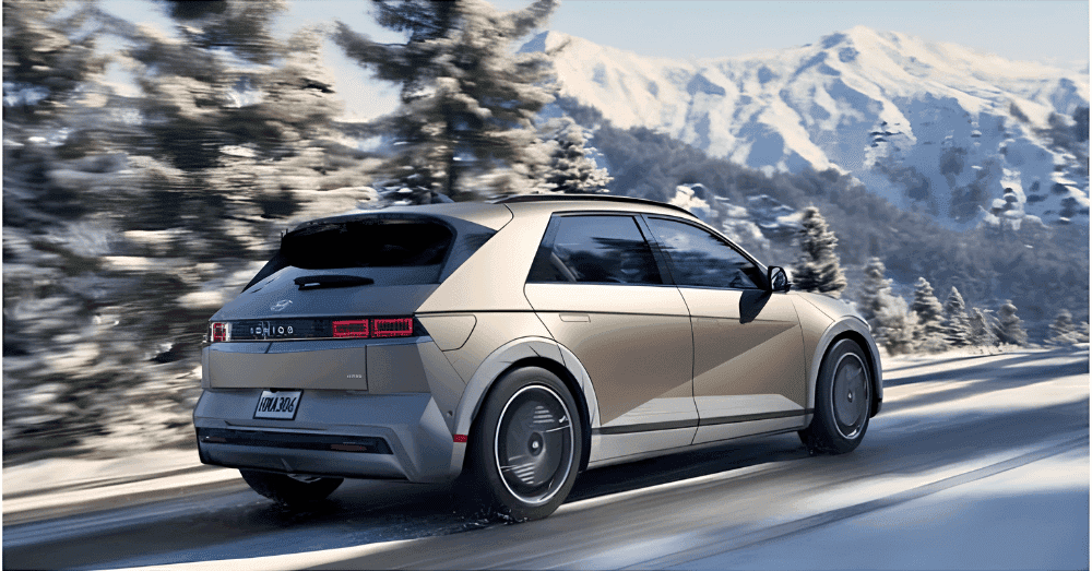 Prepping Your Hyundai Hybrid Cars for Indianapolis Winters - an IONIQ 5 driving through a snowy mountain pass