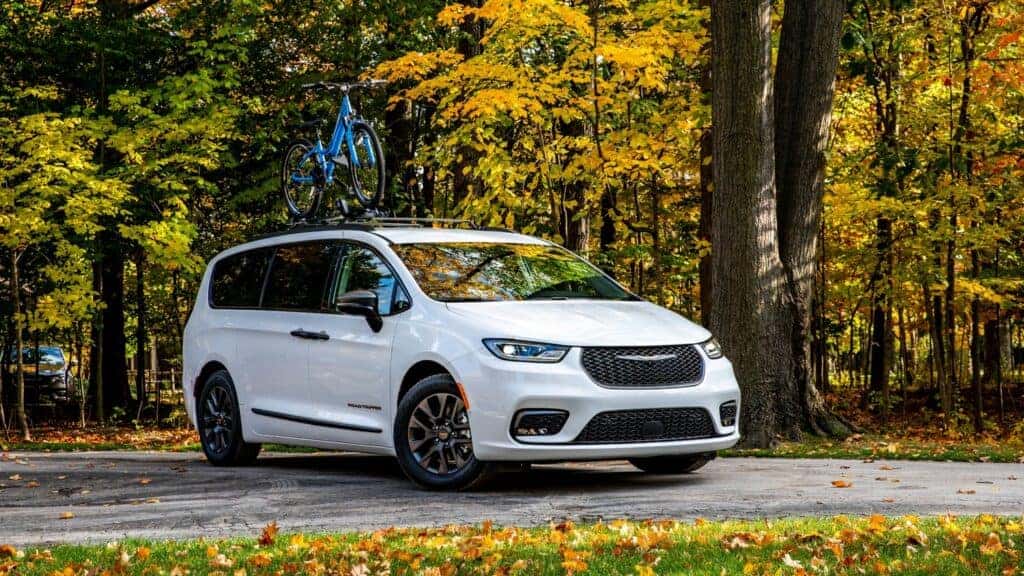 2023 Chrysler Pacifica parked under trees