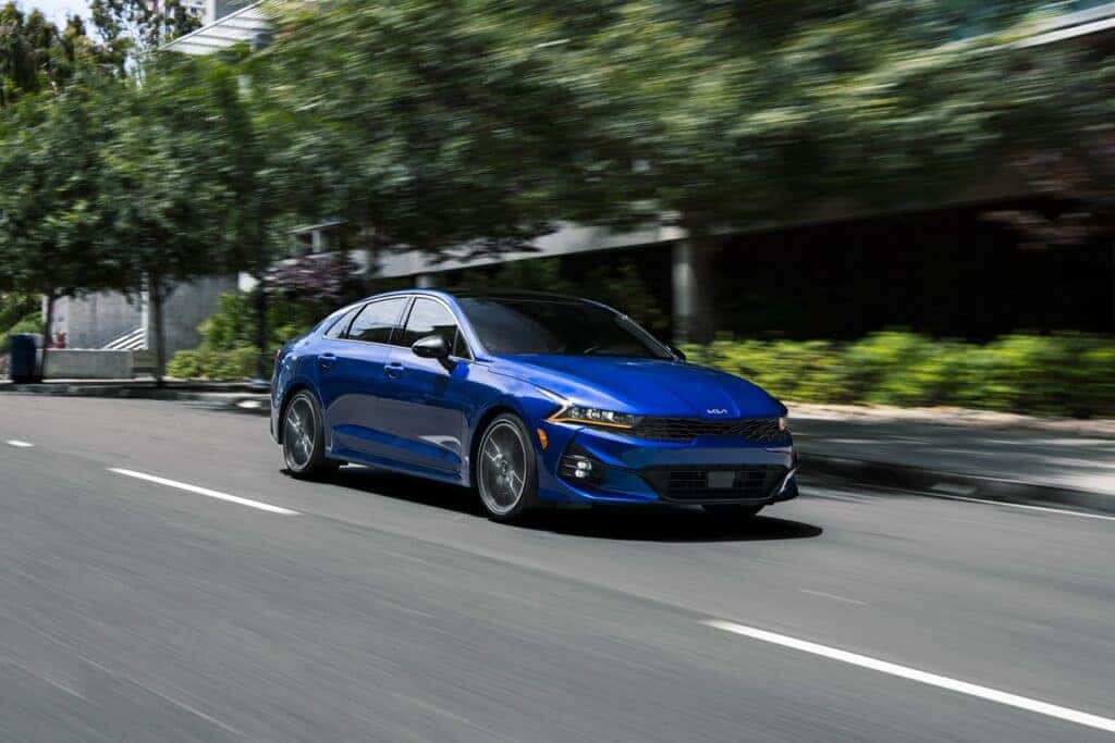 Blue 2024 KIA K5 on the street 