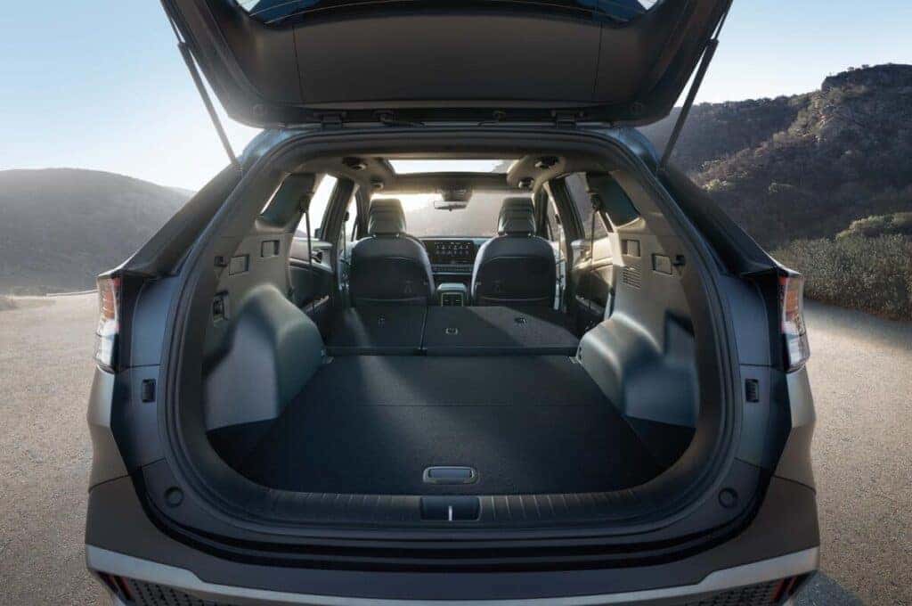 The cargo area of a 2025 KIA Sportage, showcasing its spacious interior and sleek design features for optimal storage.