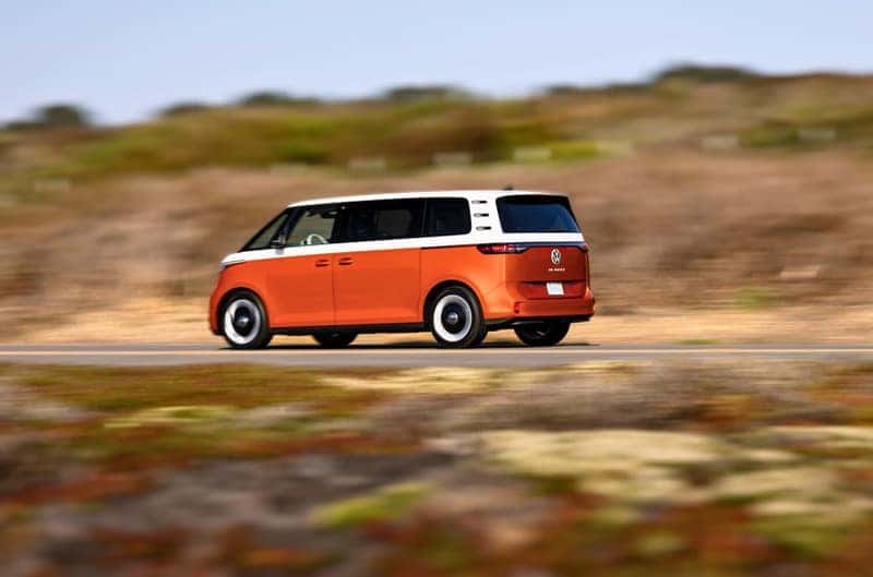 The 2025 VW ID.Buzz in Energetic Orange driving with peace of mind due to the it's long range
