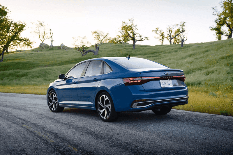 A new light bar connects the taillights, while sharp LED taillight clusters highlight the sedan's wide stance.