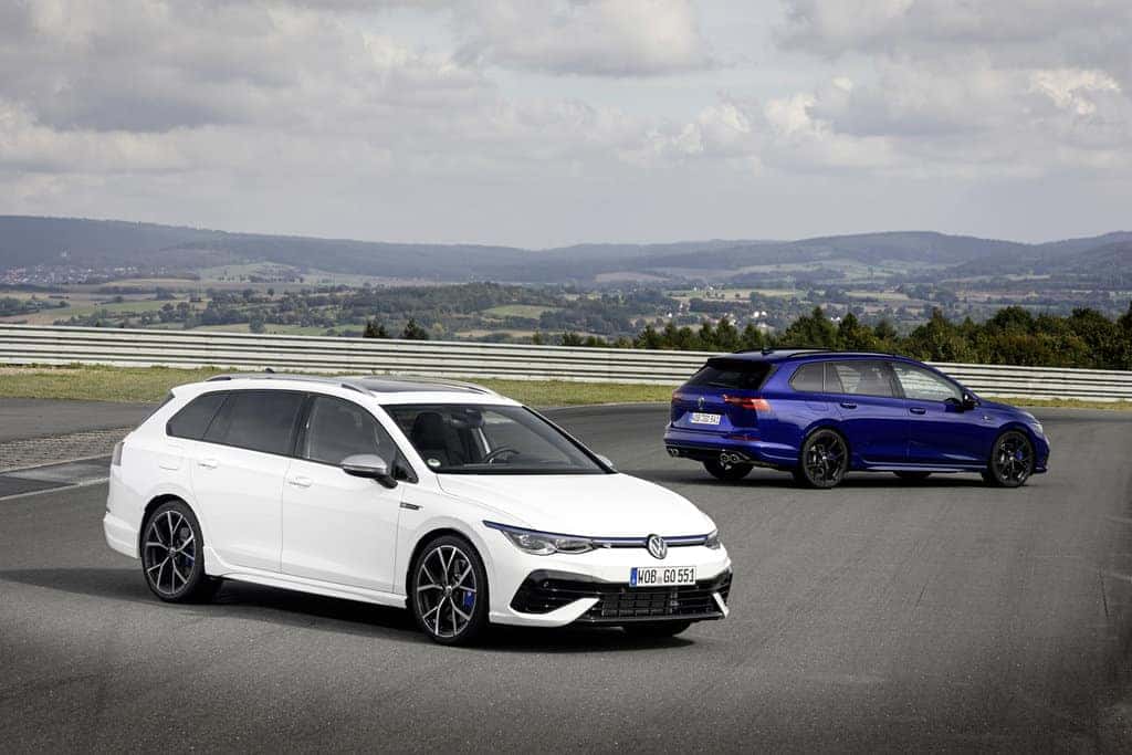 White and Blue Volkswagen Golf R open road mountains
