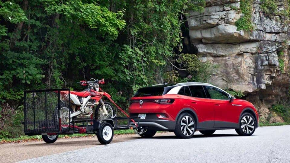 Red Volkswagen ID.4 SUV Motorbike tow hook outside