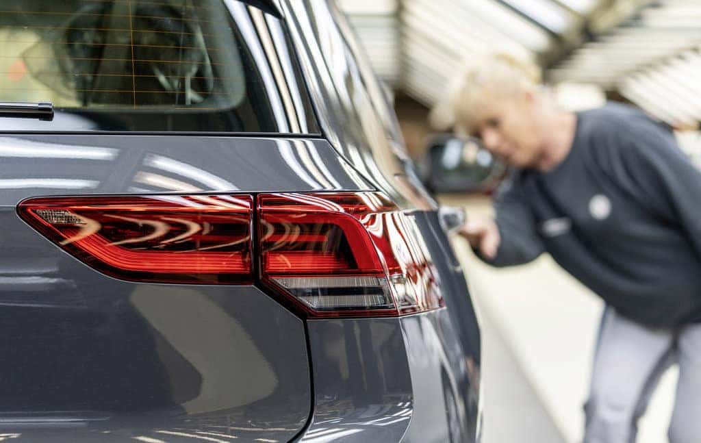 Gray Volkswagen Vehicle Inside Factory Woman