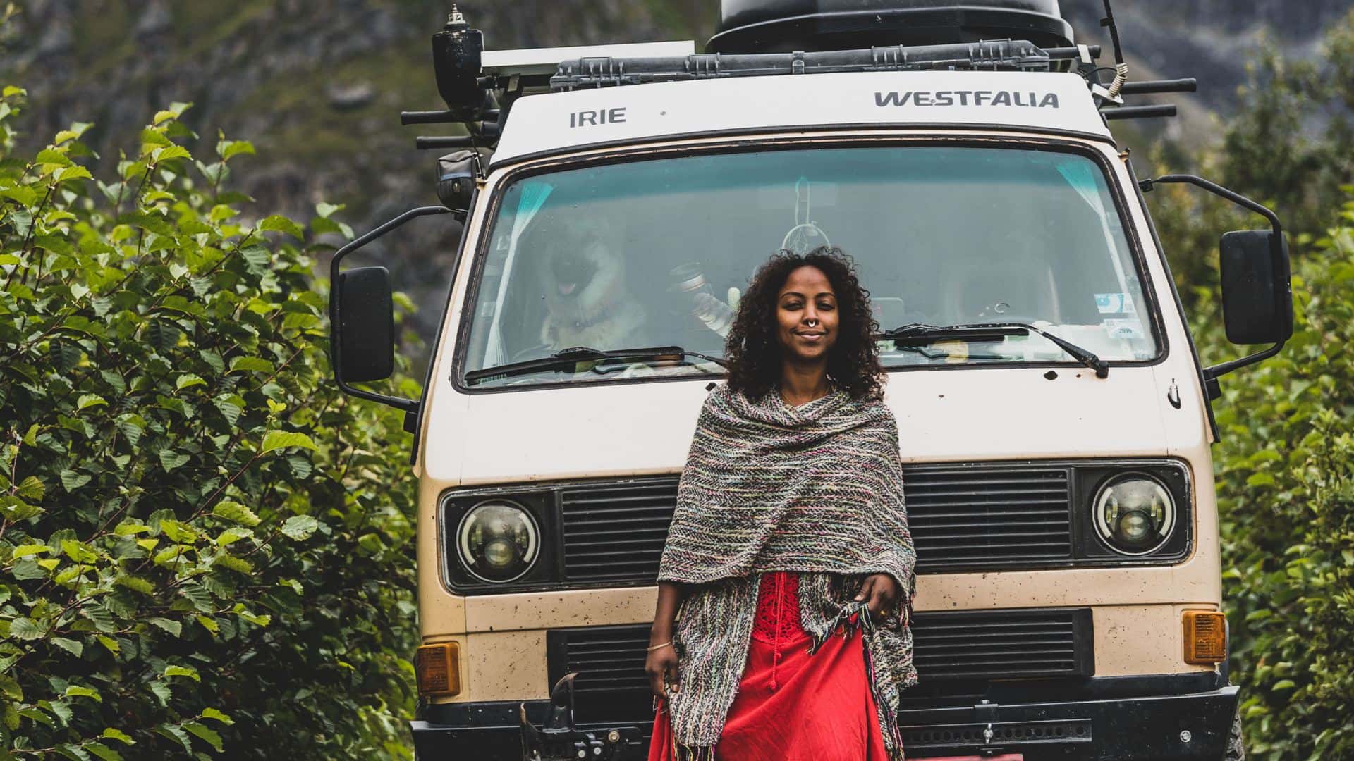 Tan Volkswagen Van Woman Green Bushes