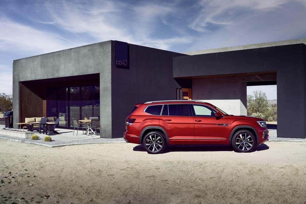 Red Volkswagen Atlas R-Line Outside Gray House Dirt Blue Sky