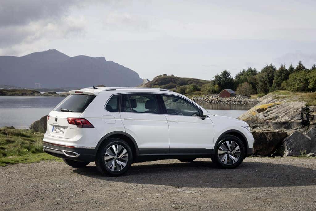 White Volkswagen Tiguan SUV Mountains Water Trees
