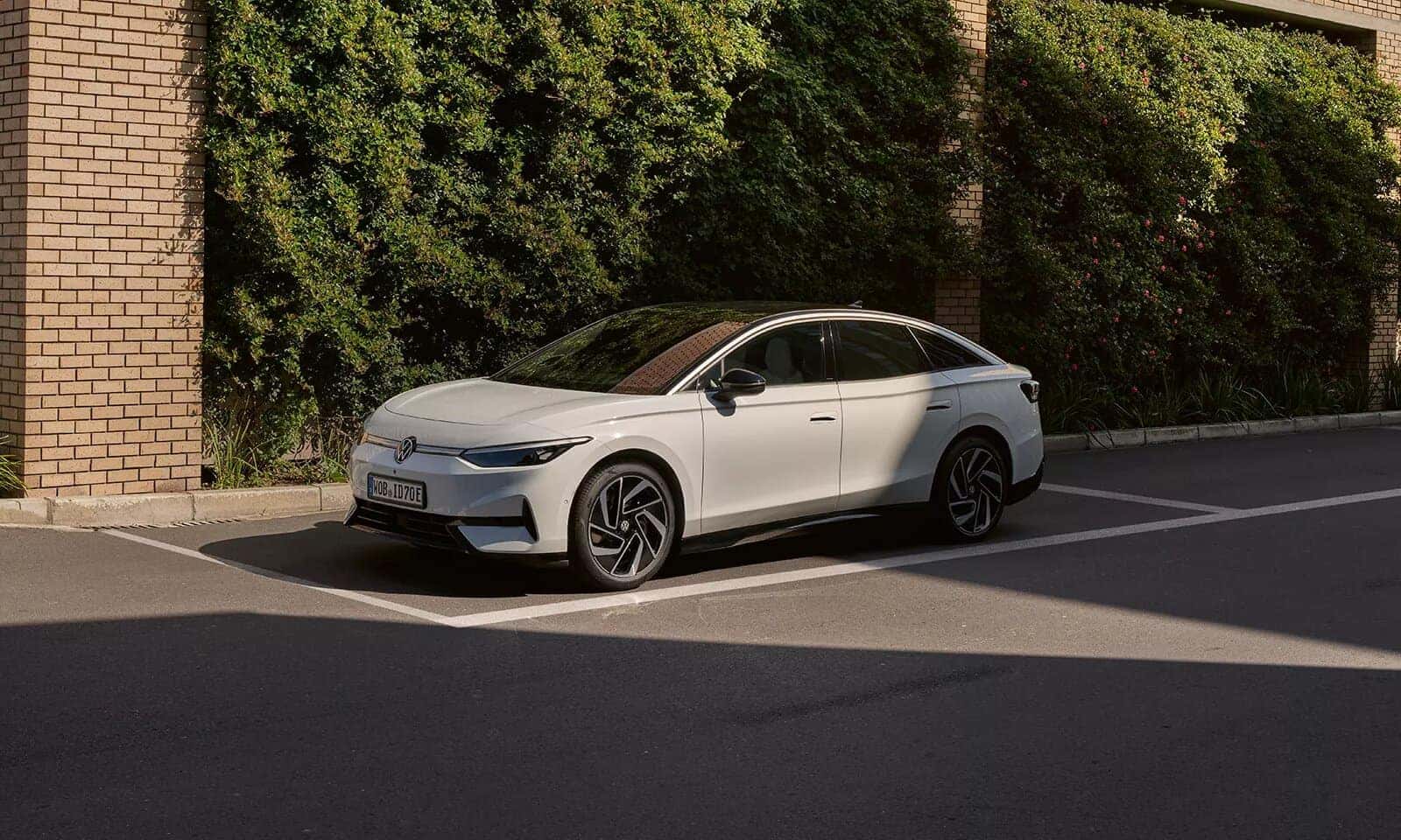 White Volkswagen ID.7 EV SUV Trees