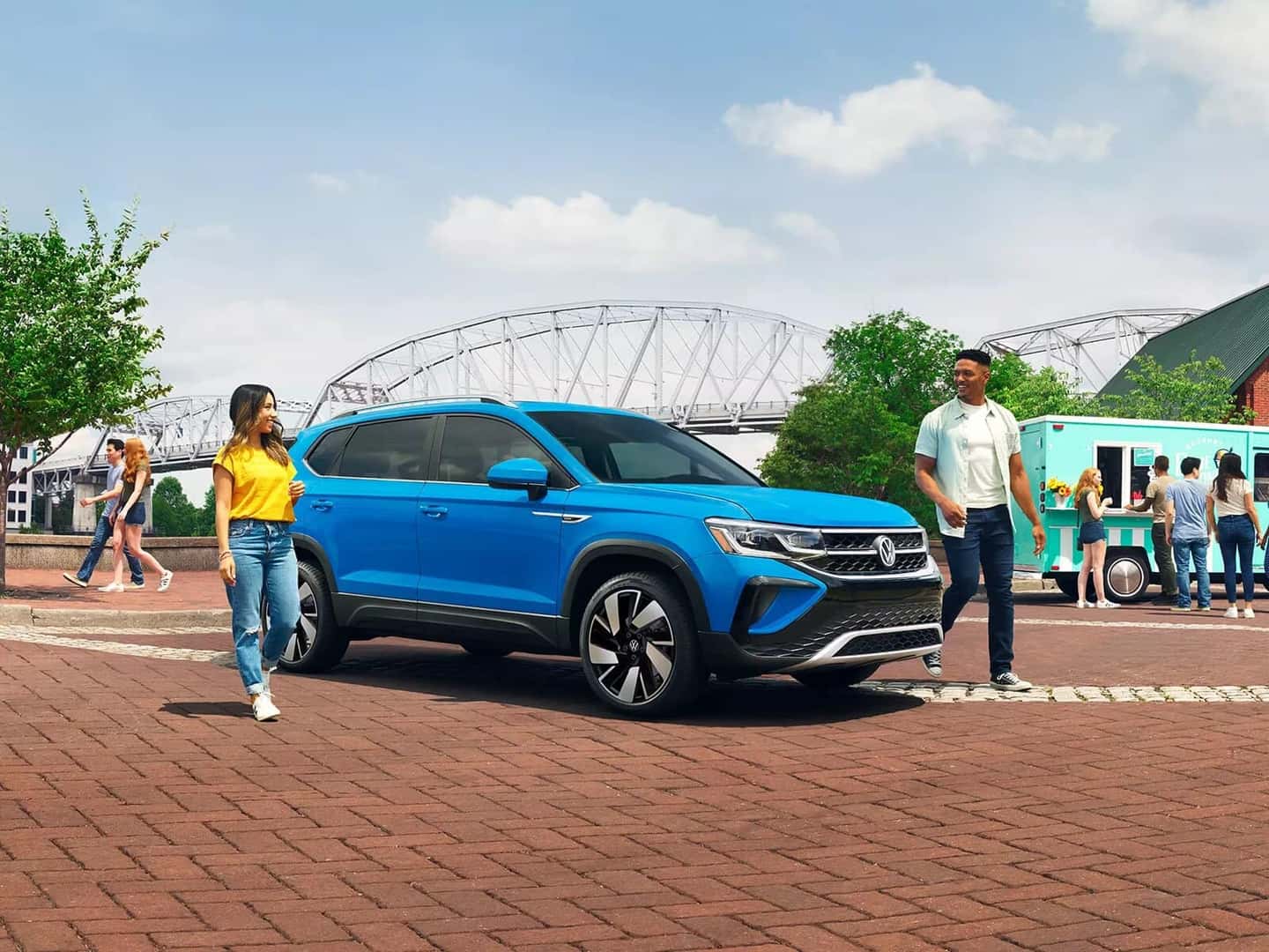 Blue Volkswagen Taos People Bridge