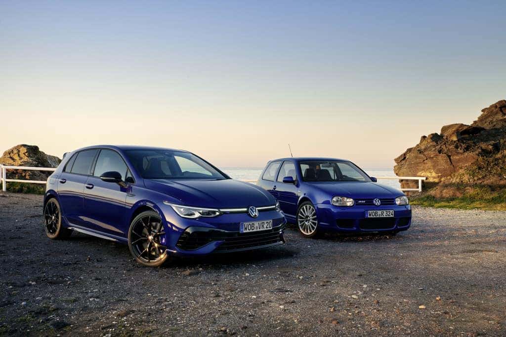 Two Blue Volkswagen Golf R Hatchbacks Mountains Water Sky