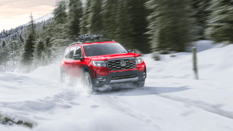 2023 Honda Passport exterior on a snowy road