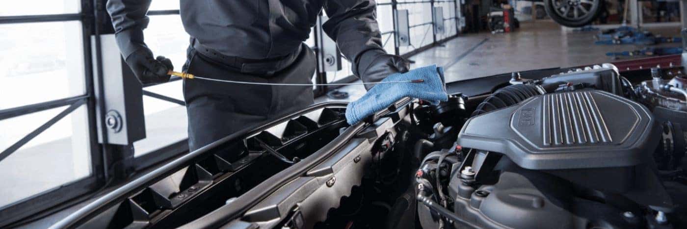 Close up view of a service tech working on an engine