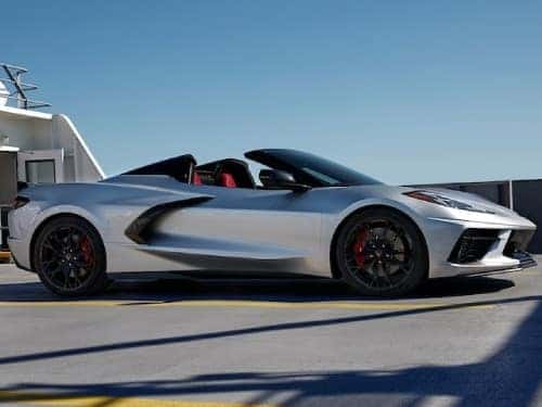 2024 Chevrolet Corvette Stingray side profile exterior view of car parked with top off on a sunny day