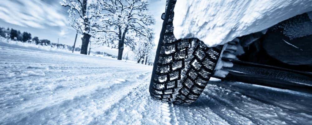 Car tires on winter road