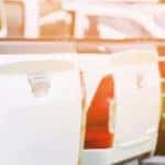photo of the rear end of 3 pick up trucks parked in a row